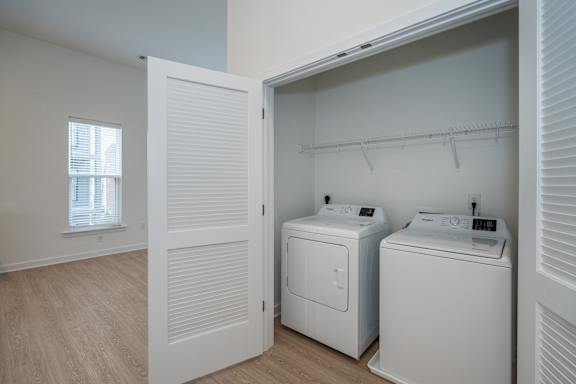 Laundry area with a full size, side by side washer and dryer
