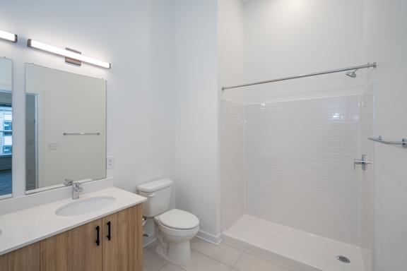 Modern bathroom with tile flooring and stand up shower
