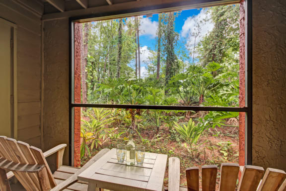 a room with a table and chairs and a large window at Timberwalk at Mandarin Apartment Homes, Florida, 32257