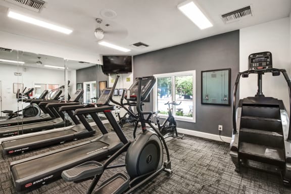 the gym is equipped with cardio equipment and weights at Timberwalk at Mandarin Apartment Homes, Florida, 32257