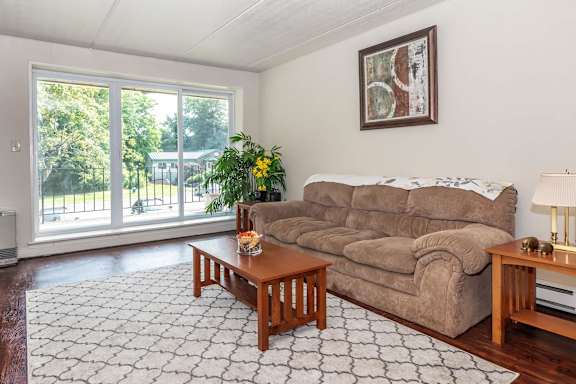 Living Room With Balcony at North Pointe Apartments, Clifton Park