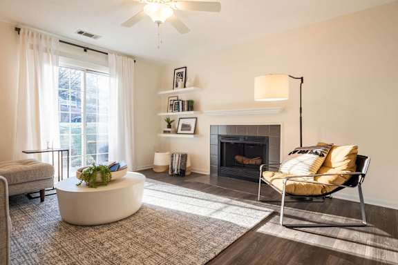 a living room with a couch and a fireplace