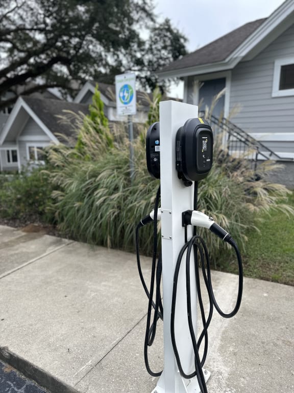 a electric charger in front of a house at The Monroe Apartment Homes, Tallahassee, 32303