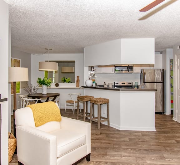 an open kitchen and living room with a couch and a table at Timberwalk at Mandarin, Florida, 32257