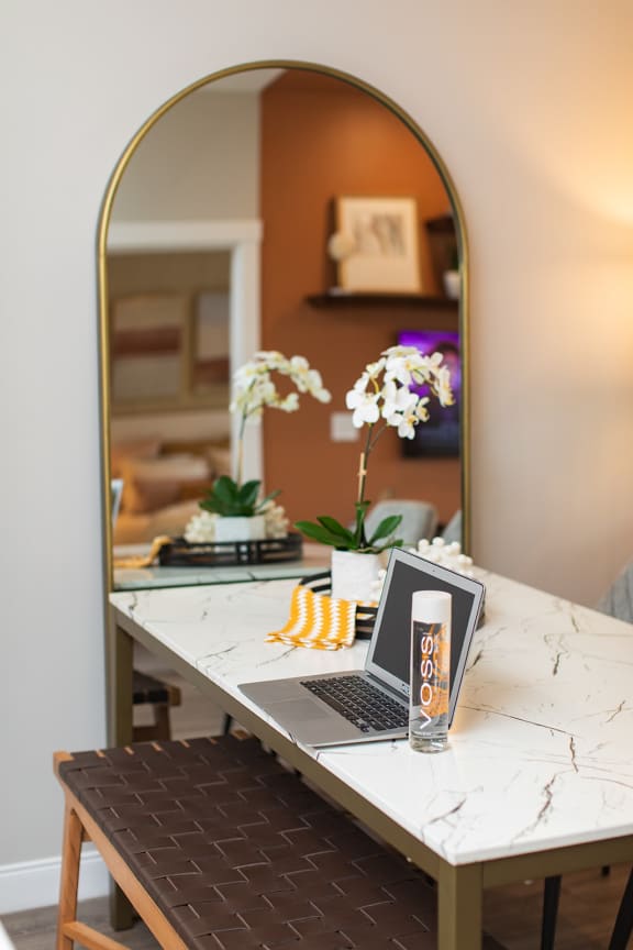 a laptop computer sitting on a table in front of a mirror at The Yards at Malvern, Malvern, PA