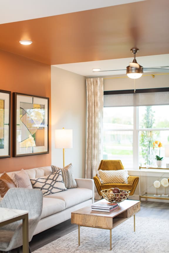 a living room with a couch and a chair and a window at The Yards at Malvern, Malvern, PA
