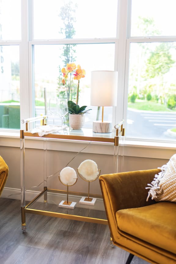 a living room with a couch and a table and a window at The Yards at Malvern, Malvern, PA