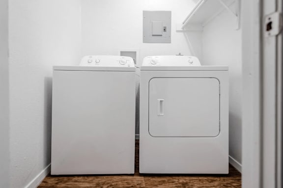 A white washing machine and dryer at Walnut Hill, San Antonio, TX, 78229