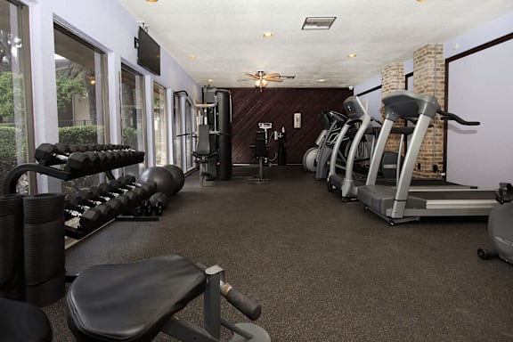 A gym with a variety of equipment at Walnut Hill, San Antonio, 78229