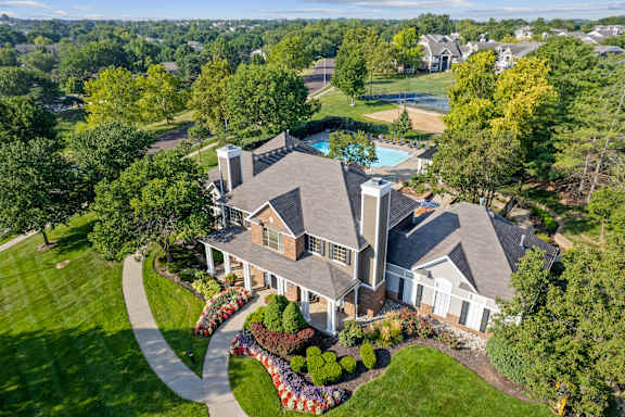 A large house with a pool in the backyard.