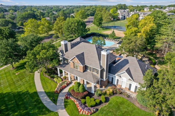 an aerial view of a large house with a pool in the backgroundat Stonebriar Woods Apartments, Kansas, 66213