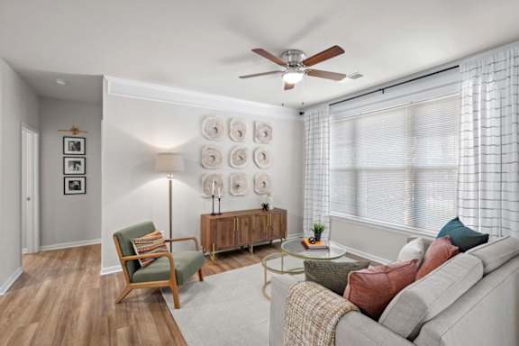 Lavish Living room with Oversized windows with blinds at Deer Creek Apartment Homes, Overland Park, Kansas