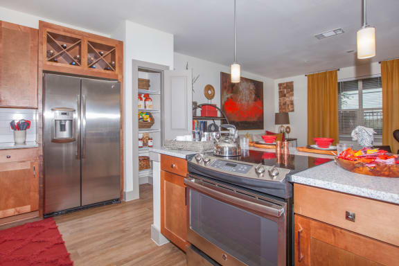 kitchen with stainless steel appliances at Ovation at Lewisville Apartments, Lewisville