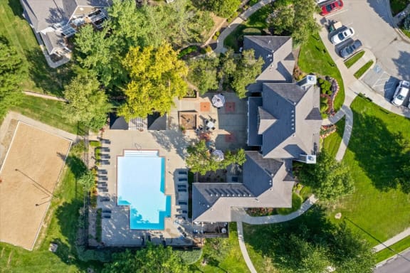 arial view of a house with a swimming poolat Stonebriar Woods Apartments, Kansas