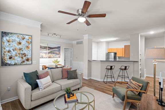 Spacious Decorated Living room with Ceiling Fan at Deer Creek Apartment Homes, Overland Park, KS