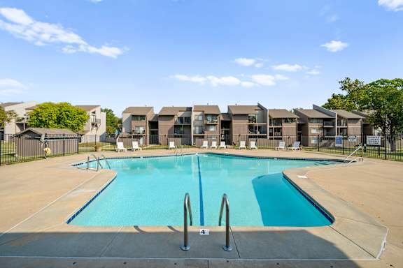 Swimming Pool surrounded by the Lounge chairs at Bremerton Park Apartment Homes , Prairie Village, 66204