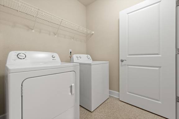 White washing machine and dryer at The Residences at Bluhawk Apartments, Overland Park, KS