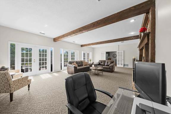 A room with a black chair and a computer desk.