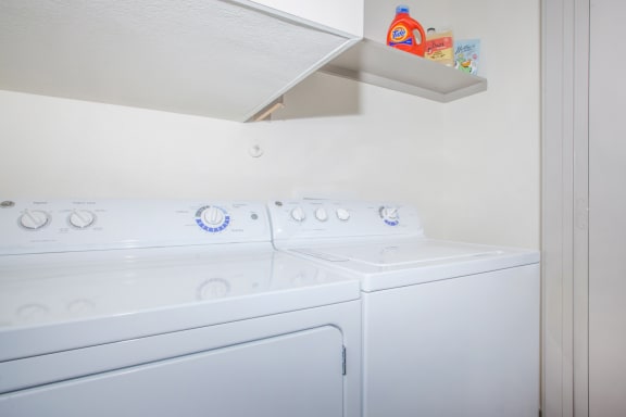 washer and dryer in apartment at Ovation at Lewisville Apartments, Lewisville, Texas