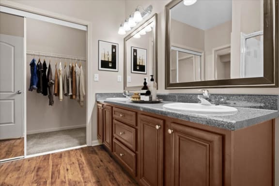 a bathroom with a sink and a mirror at Stonepost Ranch, Overland Park