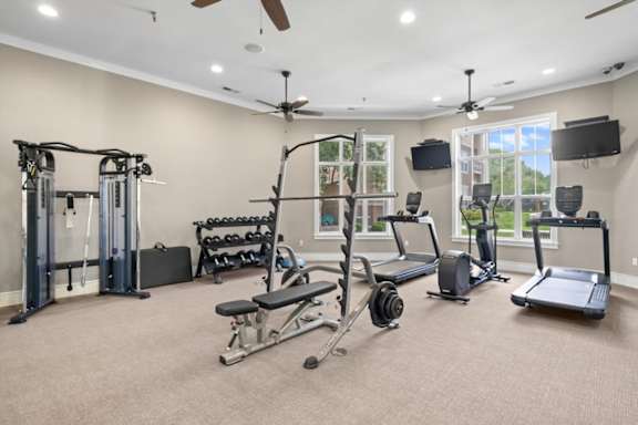 A spacious home gym with a variety of exercise equipment. at Stonepost Lakeside Apartment Homes, Olathe, Kansas