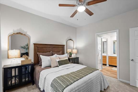 Bedroom with cozy bed and nightstand at Deer Creek Apartment Homes, Overland Park, KS