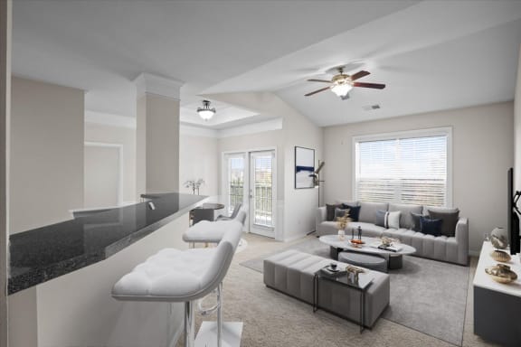 a living room with a couch and a table at Stonepost Ranch, Overland Park, KS