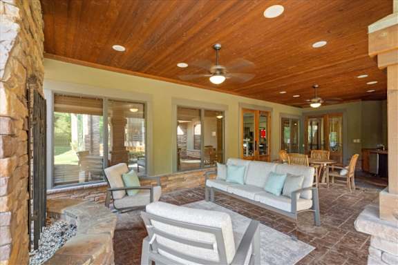 Fireplace in the outdoor covered patios at Deer Creek Apartment Homes, Overland Park, KS