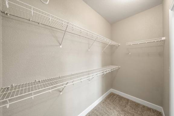 Empty white shelves at The Residences at Bluhawk Apartments, Overland Park, 66085