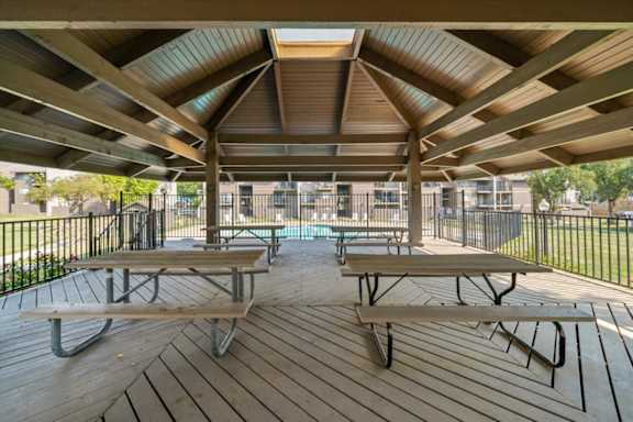 Covered Wooden deck at Bremerton Park Apartment Homes , Prairie Village, KS