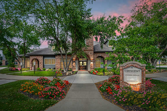 Leasing Office is surrounded by a beautiful garden. at Crescent Apartment Homes, Kansas
