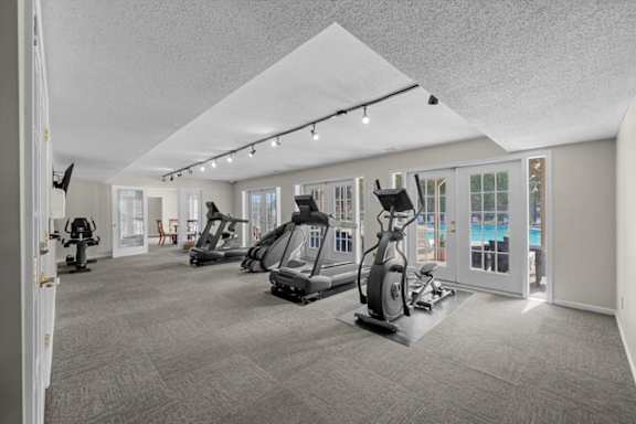 A spacious gym with a variety of exercise equipment.