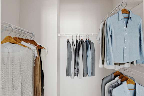 A large walk in closet with wire rack shelves.