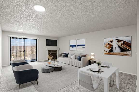 Living room with attached balcony at Cloverset Active Adult Apartments, Missouri