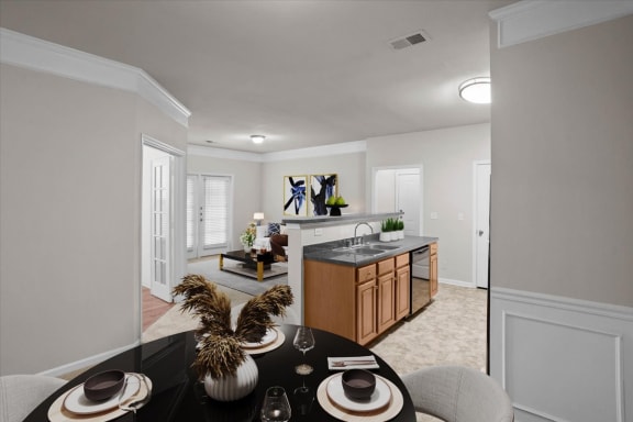 a living room and a kitchen with a table and chairs at Stonepost Ranch, Overland Park, KS