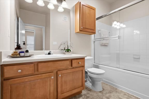 a bathroom with a sink toilet and a shower at Stonepost Ranch, Overland Park, 66221