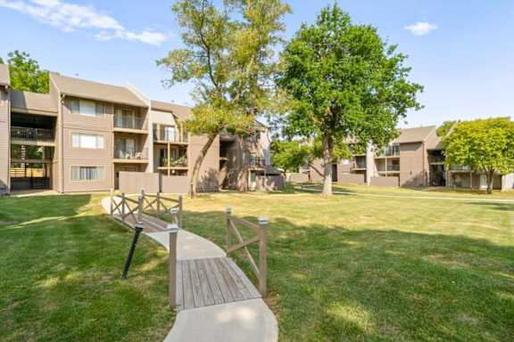Wooden walkways through the yard at Bremerton Park Apartment Homes , Prairie Village, Kansas