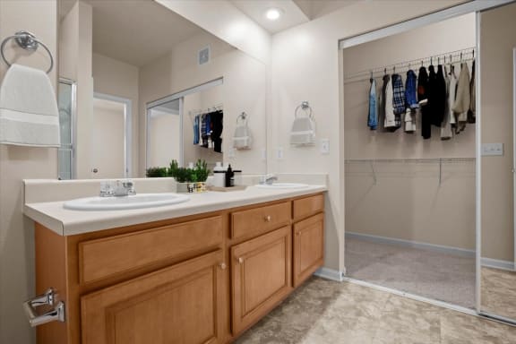 a bathroom with a sink and a shower and a mirror at Stonepost Ranch, Overland Park, KS, 66221