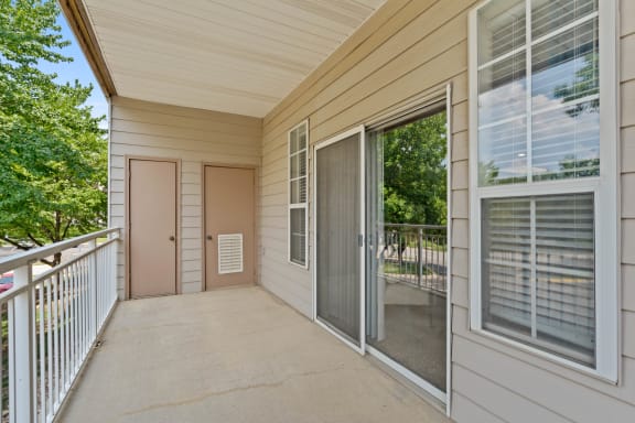 a large balcony with a door that leads to a balcony at Claremont, Overland Park, KS