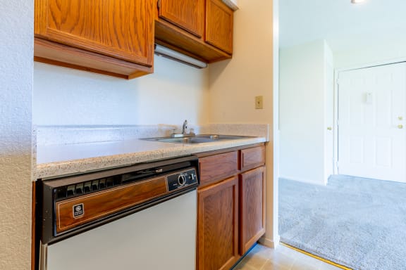 Kitchen gallery with wooden cabinetat Coventry Oaks Apartments, Kansas