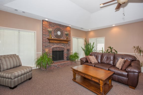 Living room fire place and tv1at Coventry Oaks Apartments, Overland Park, Kansas
