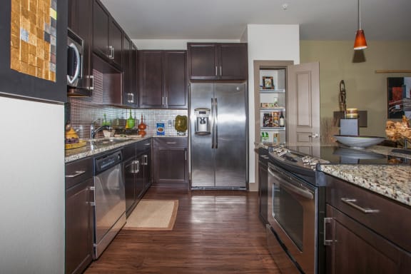 kitchen area with cabinets, refrigerator, microwave at Cypress at Lewisville Apartments , Lewisville, Texas , 75067