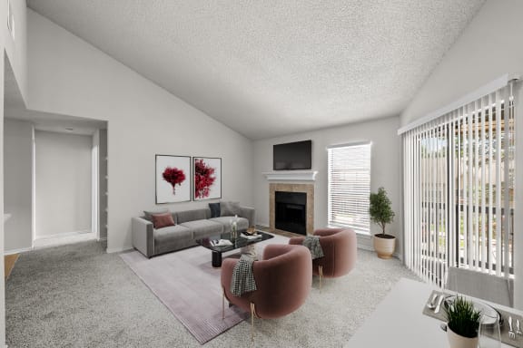 a living room with a couch and a chair and a fireplace
