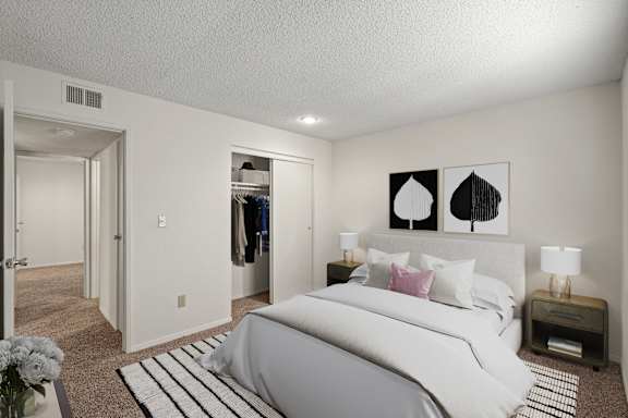 A secondary bedroom with a sliding door closet.