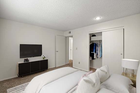 A secondary bedroom with a sliding door closet.