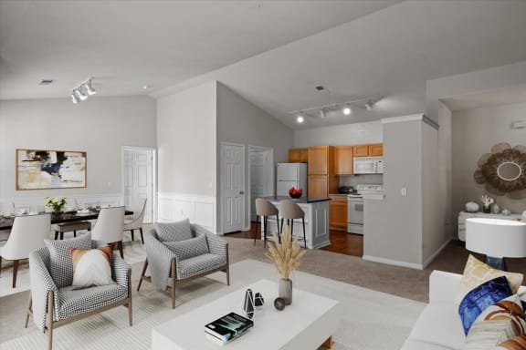 a living room and kitchen with a table and chairs
