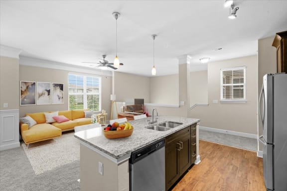a kitchen and living room with a counter top