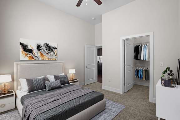 A bedroom with a large bed and a painting on the wall.