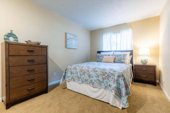 Bedroom with windowat Preston Court Apartments, Overland Park, Kansas