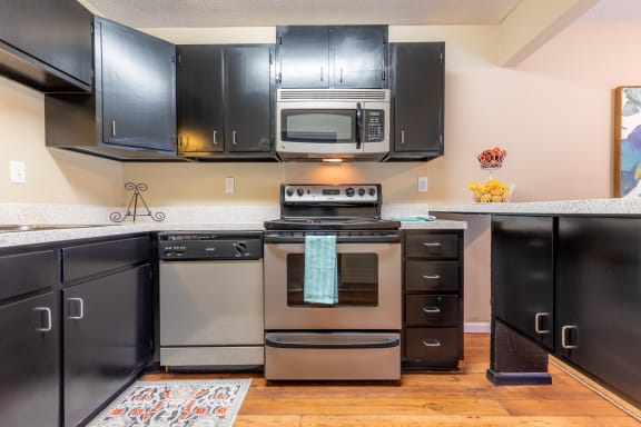 Kitchen with steel appliances at Preston Court Apartments, Kansas, 66212